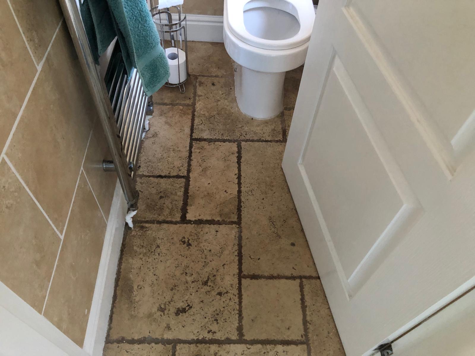 Travertine WC Floor Before Cleaning Bolton